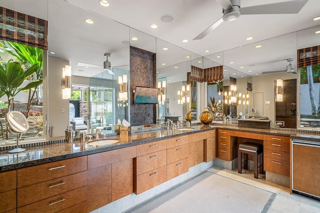 bathroom featuring a ceiling fan, recessed lighting, and vanity