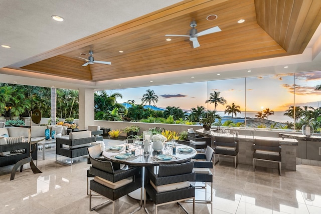 view of patio featuring outdoor dining area, outdoor lounge area, and a ceiling fan