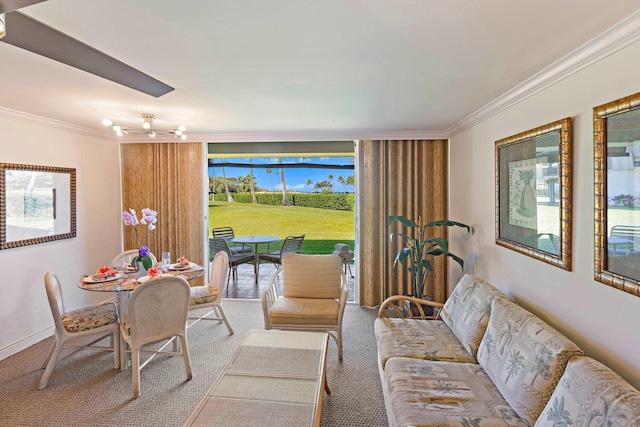 living area with crown molding, carpet, and baseboards