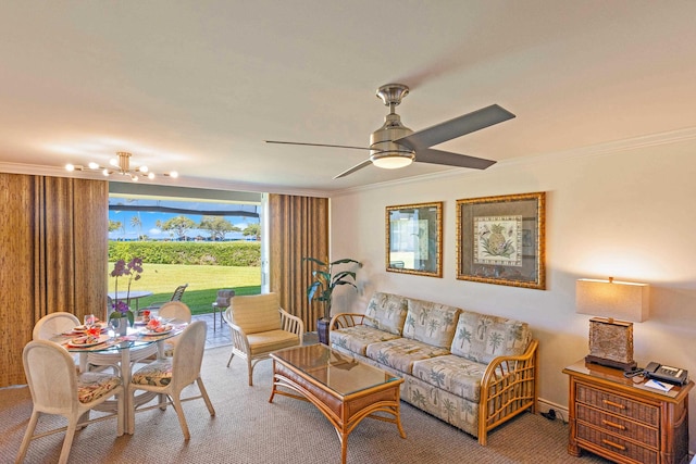 carpeted living area with ceiling fan with notable chandelier and crown molding