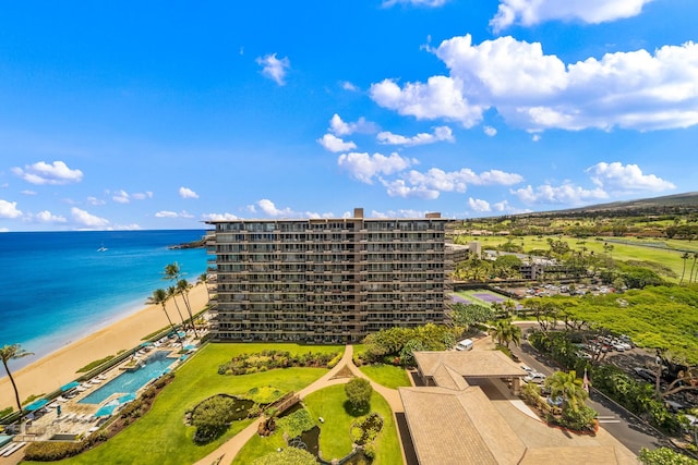 drone / aerial view featuring a beach view and a water view