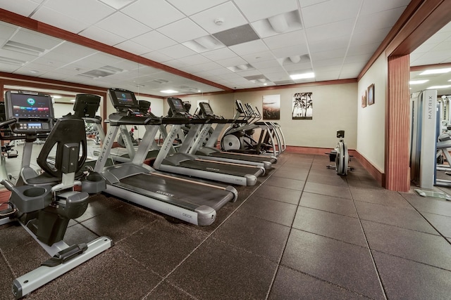 exercise room featuring a drop ceiling