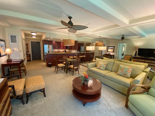 living room featuring coffered ceiling, beam ceiling, ceiling fan, and carpet