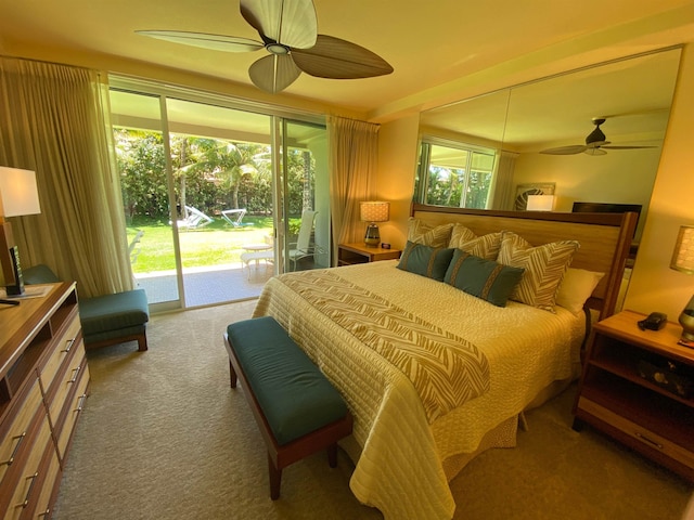 carpeted bedroom featuring multiple windows, ceiling fan, and access to exterior