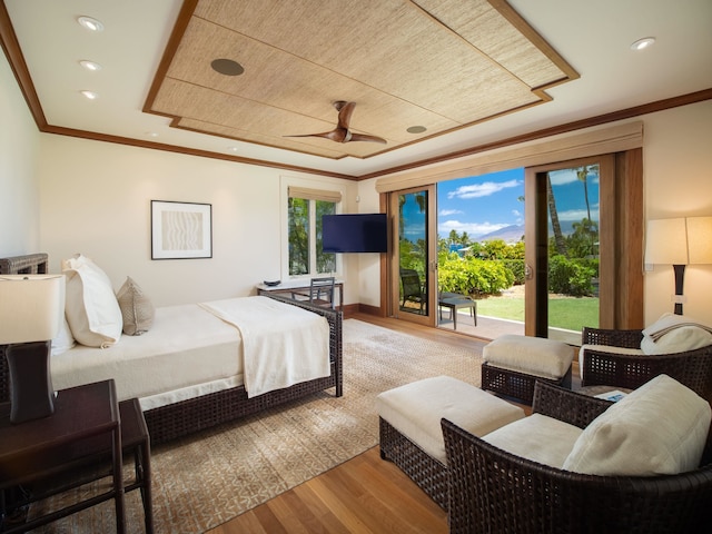 bedroom featuring access to exterior, ornamental molding, hardwood / wood-style floors, and ceiling fan