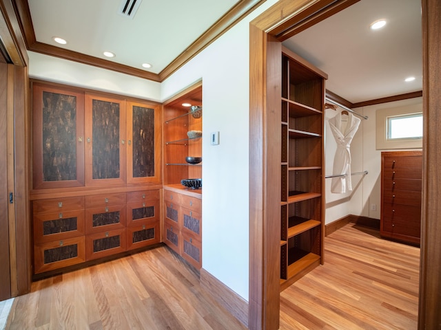 spacious closet featuring light hardwood / wood-style floors