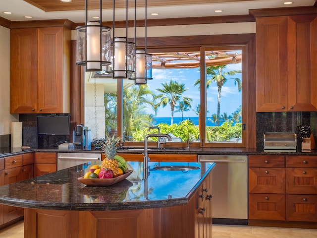 kitchen with dark stone countertops, dishwasher, and tasteful backsplash