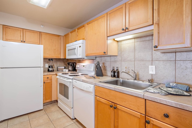4327 Lower Honoapiilani Rd Unit 1002B, Lahaina, HI 96761 - kitchen featuring white appliances, a sink, light countertops, and light tile patterned floors
