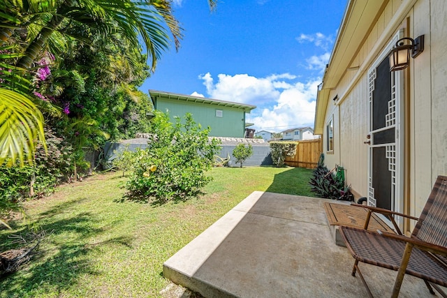 view of yard featuring a patio and a fenced backyard