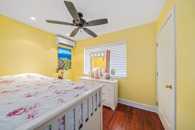 bedroom with dark wood-type flooring, a wall unit AC, recessed lighting, baseboards, and ceiling fan