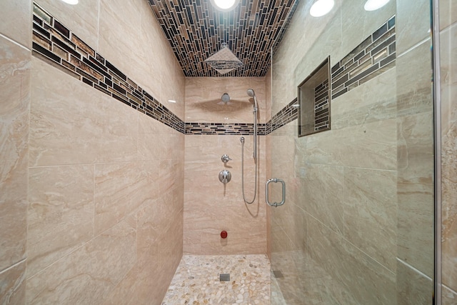 full bathroom featuring a shower stall