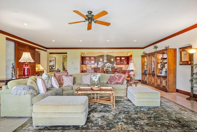 tiled living room with ceiling fan and ornamental molding