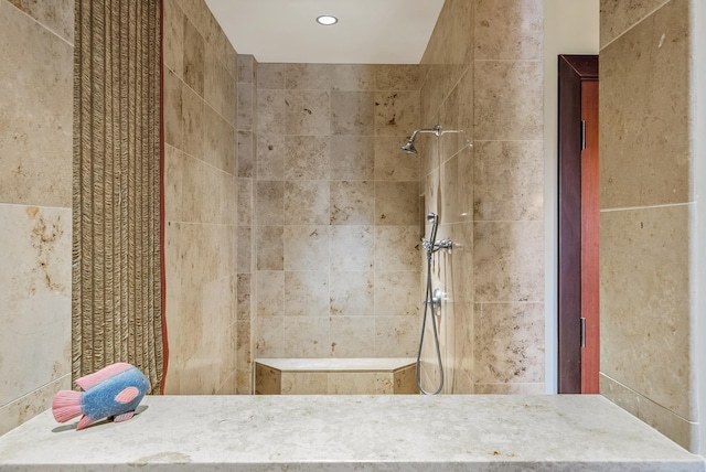 bathroom with tiled shower