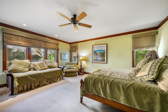 bedroom featuring ceiling fan, carpet floors, and ornamental molding