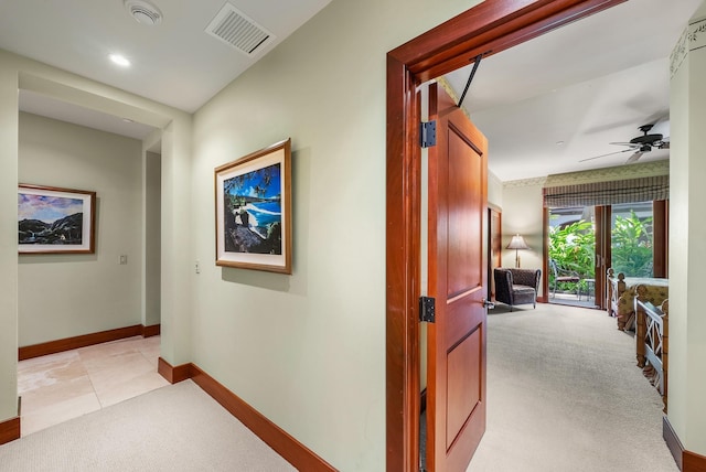 hall featuring french doors and light colored carpet