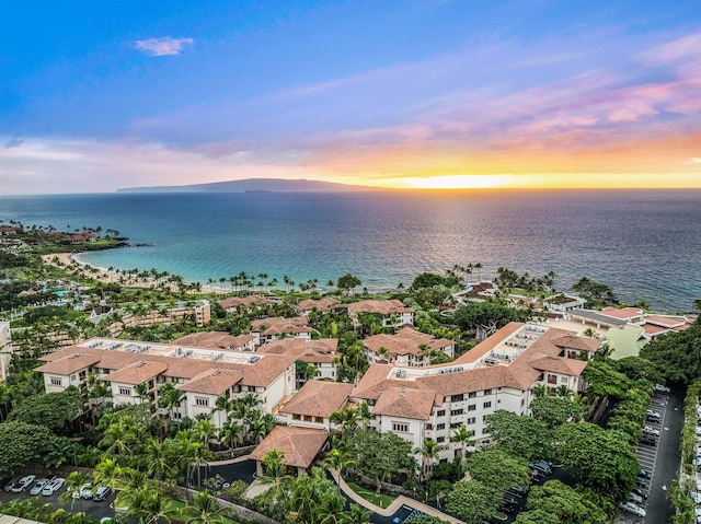 aerial view at dusk with a water view