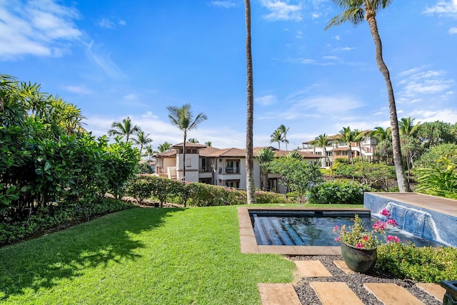 view of pool featuring a yard