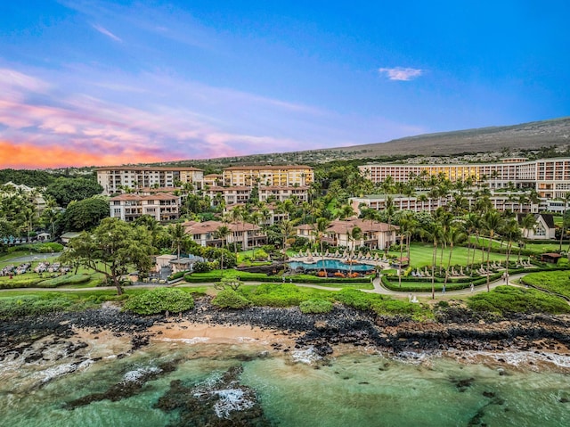 aerial view at dusk with a water view