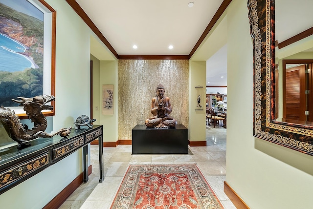 corridor with light tile patterned flooring and crown molding