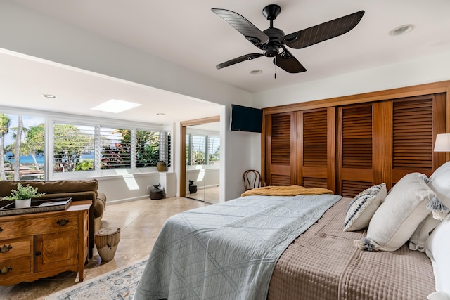 tiled bedroom with ceiling fan