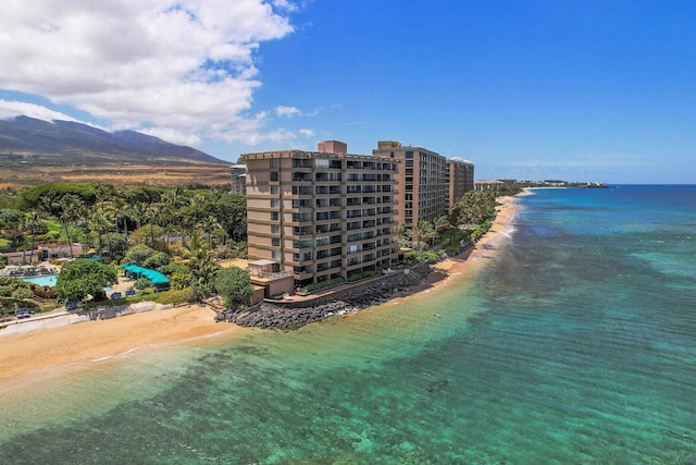 bird's eye view featuring a view of the beach and a water view