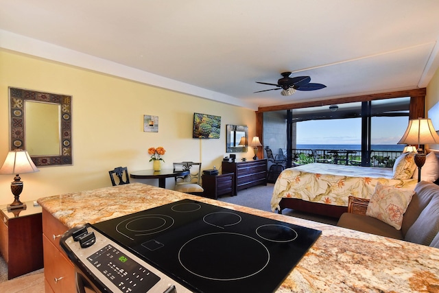 bedroom featuring access to exterior and ceiling fan