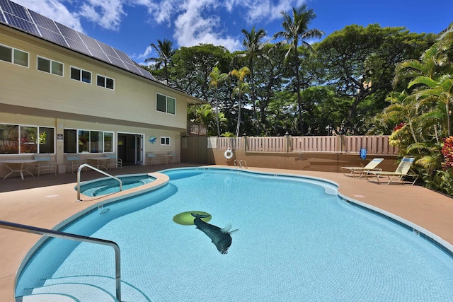 view of pool featuring an in ground hot tub and a patio area