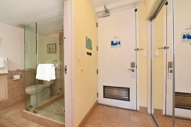 bathroom featuring tile patterned flooring and walk in shower