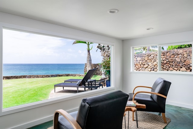 sitting room featuring a water view