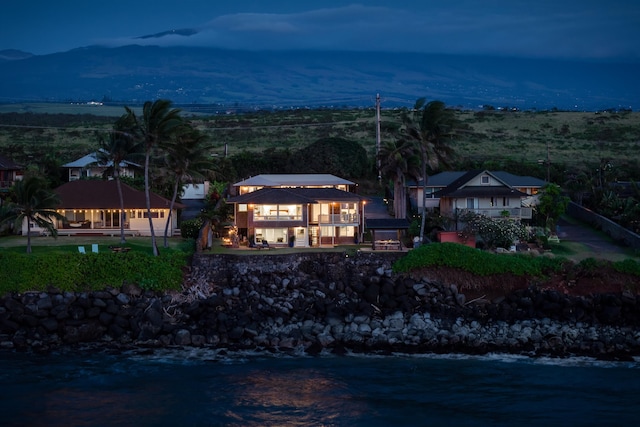 exterior space featuring a water and mountain view