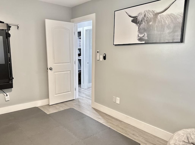 550 Kailana St, Wailuku, HI 96793 - unfurnished bedroom featuring baseboards and wood finished floors