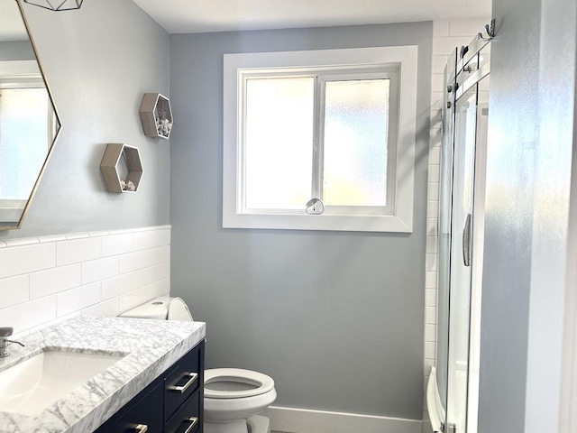 550 Kailana St, Wailuku, HI 96793 - full bathroom with toilet, vanity, a shower with shower door, and decorative backsplash