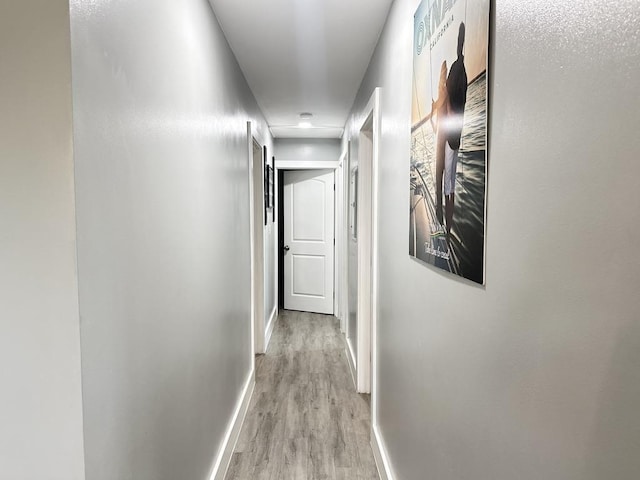 550 Kailana St, Wailuku, HI 96793 - hallway with baseboards and light wood finished floors