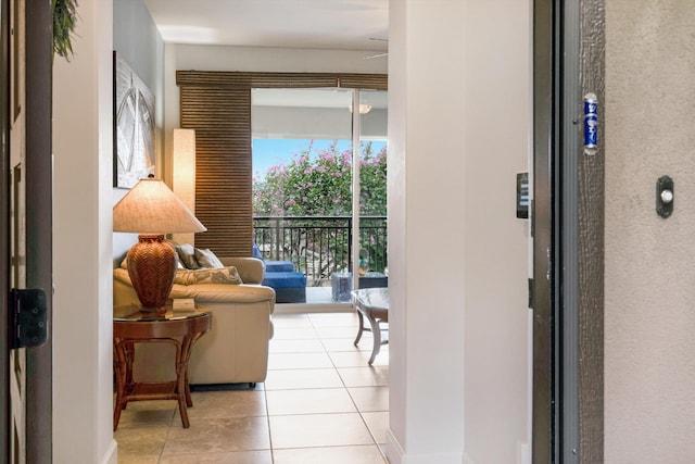interior space with baseboards and light tile patterned floors