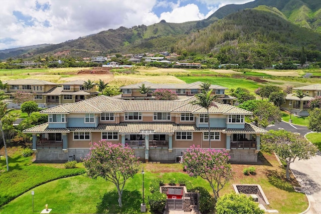 birds eye view of property featuring a mountain view