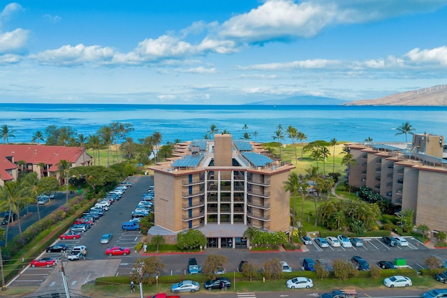 aerial view featuring a water and mountain view