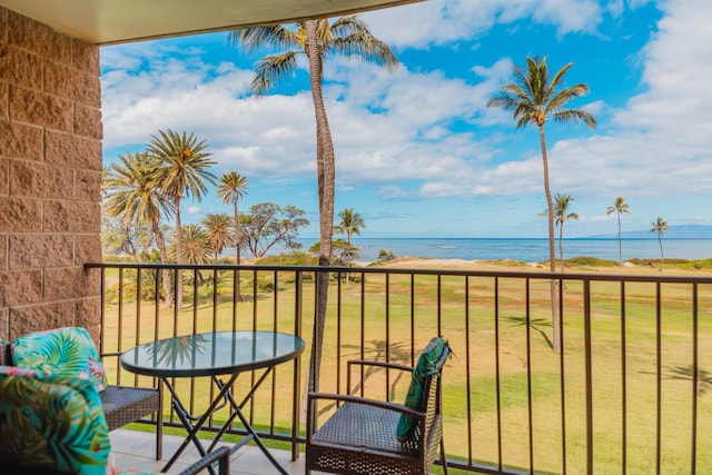 balcony featuring a water view