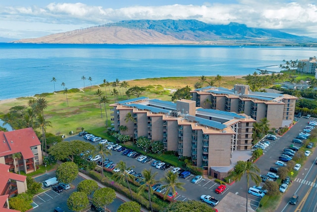 birds eye view of property featuring a water and mountain view