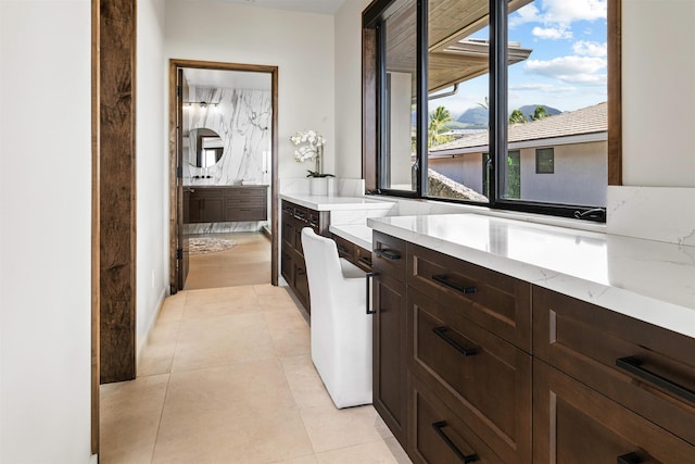 bathroom featuring tile patterned floors and vanity