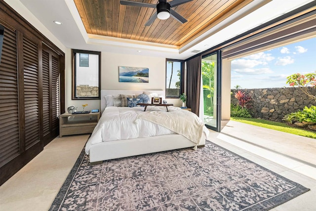 bedroom featuring access to exterior, multiple windows, ceiling fan, and wood ceiling