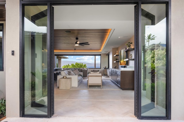 view of patio / terrace with ceiling fan and an outdoor kitchen