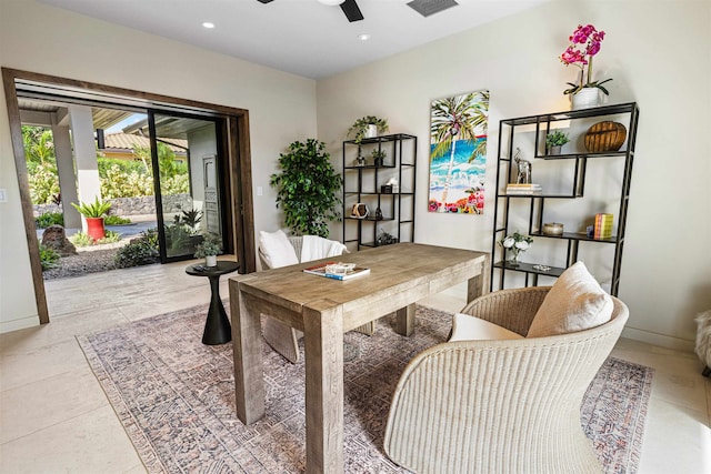 tiled office space featuring ceiling fan