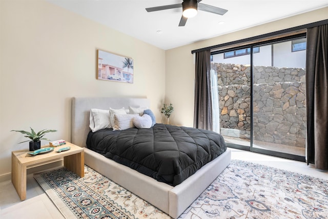 bedroom with access to exterior and ceiling fan