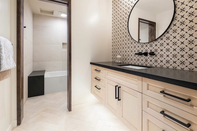 bathroom featuring vanity, backsplash, and tile walls