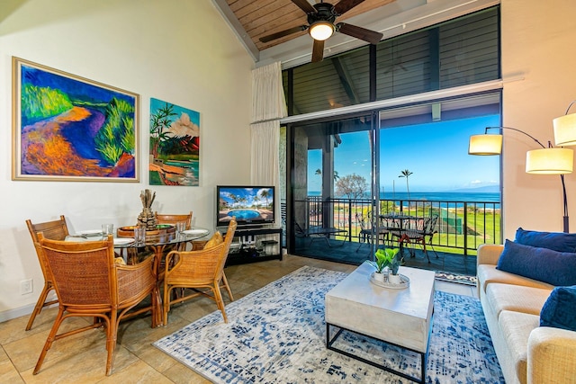 living room featuring lofted ceiling, wooden ceiling, ceiling fan, and a healthy amount of sunlight