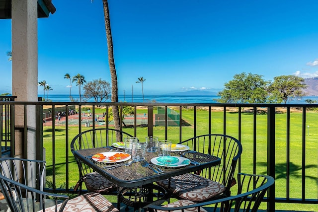 balcony featuring a water view