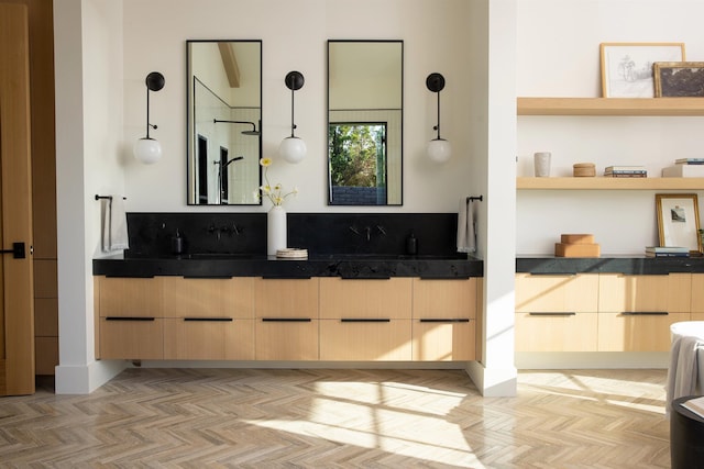 bathroom with vanity and parquet floors