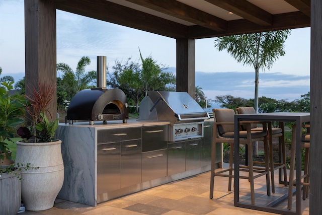 view of patio with an outdoor kitchen and grilling area