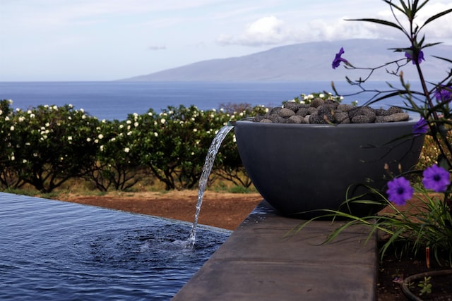 view of mountain feature featuring a water view