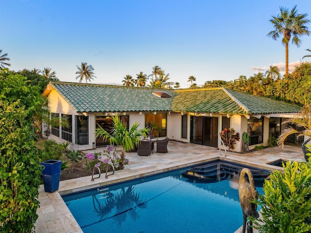 view of swimming pool with a patio